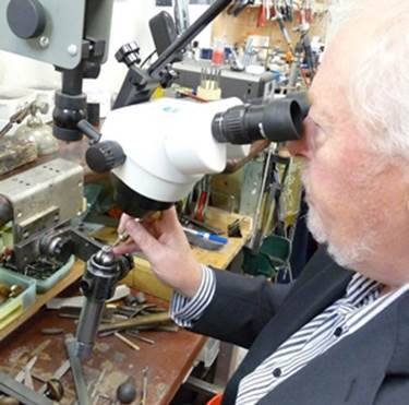 Man looking through a microscope